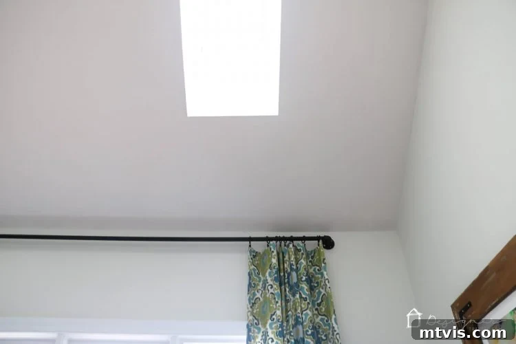 A wider view of a room with two strategically placed VELUX skylights, enhancing natural light distribution.