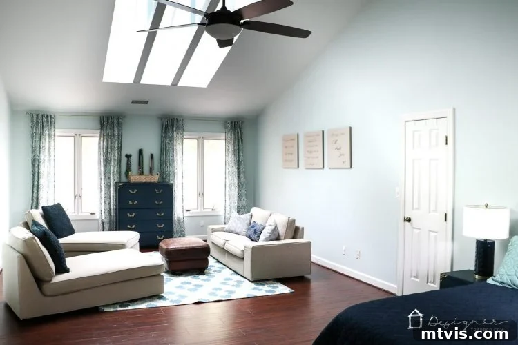 An interior shot highlighting the ample natural light from new VELUX skylights, illuminating a stylish room.