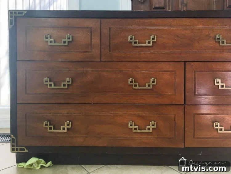 Transform Your Furniture: The DIY Restoration Guide 3 Before shot of a vintage campaign dresser, showcasing its original worn condition before DIY furniture restoration.