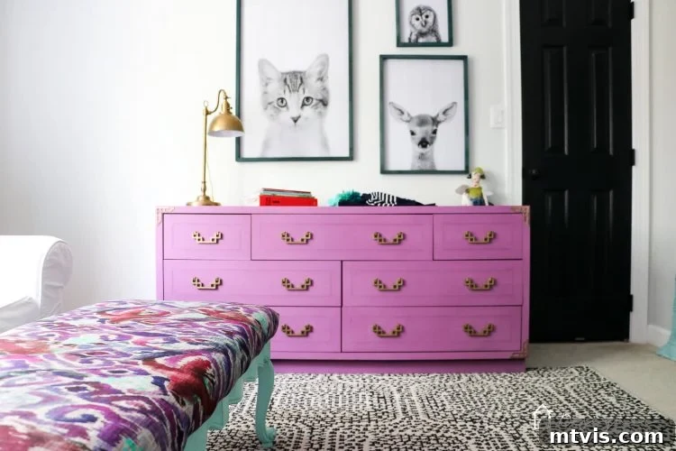 Transform Your Furniture: The DIY Restoration Guide 9 Beautifully restored campaign dresser in a vibrant purple, styled in a child's room.