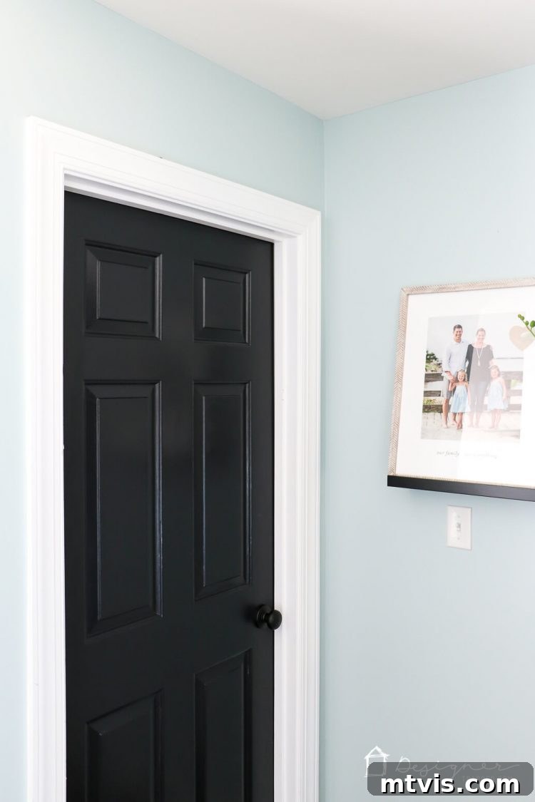 Black Doors: Instant Drama, Minimal Expense 15 Love the idea of painting interior doors black for an affordable interior update! All you have to do is paint your doors black and update the hardware. HUGE impact!