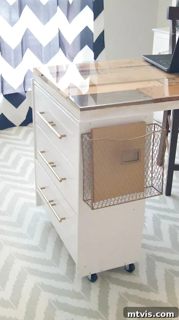 Smart IKEA Desk Upgrades on a Budget 10 A chic wooden desk, expertly crafted from IKEA drawers, features a protective glass top. This stylish piece is set against a dynamic blue and white chevron curtain, embodying a creative IKEA desk hack.