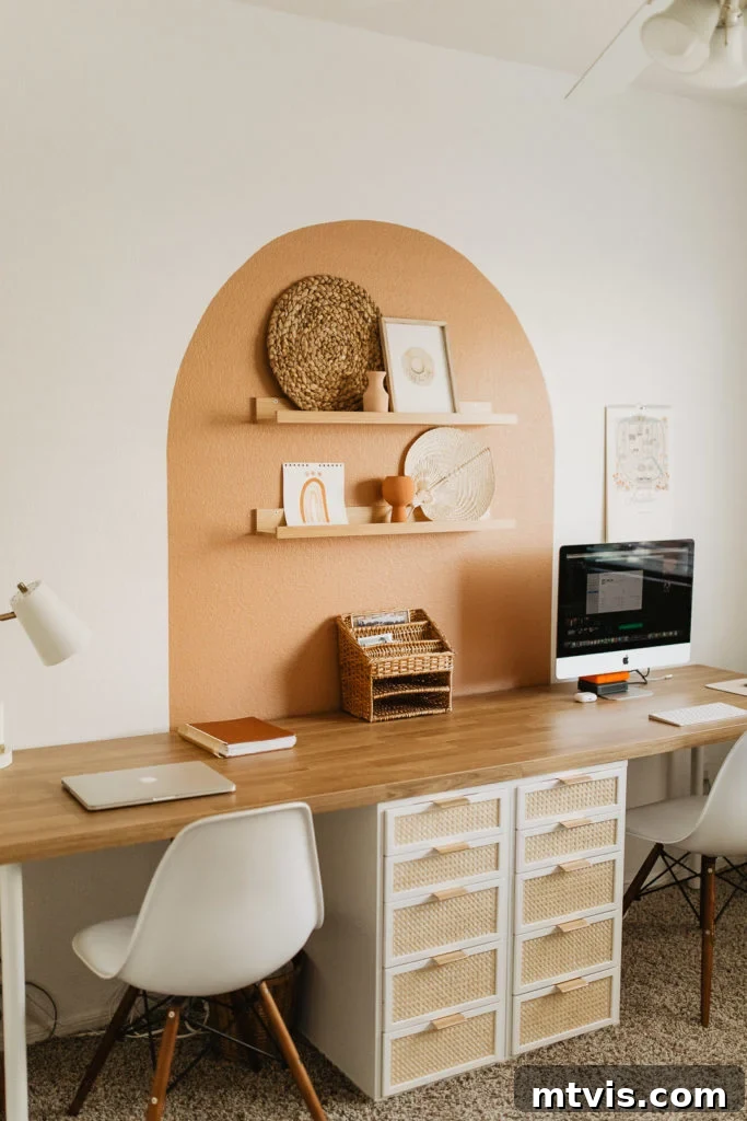 Smart IKEA Desk Upgrades on a Budget 13 An exquisite IKEA desk hack featuring beautifully caned drawers and a striking arch mural above a spacious wooden desktop with integrated shelving, creating a chic and functional workspace.
