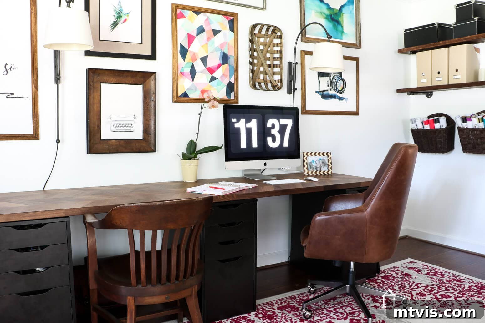 Smart IKEA Desk Upgrades on a Budget 3 This elegant IKEA desk hack features a dark wood countertop resting atop classic Alex drawers, complemented by a stylish gallery wall and functional bookshelves, creating a sophisticated home office.
