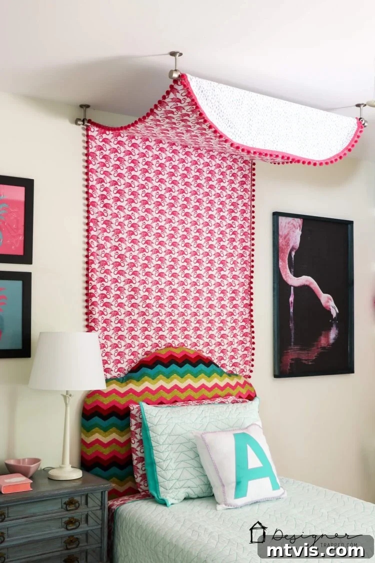 Transform Your Bed with a Flat Sheet Canopy 13 Another perspective of the charming girl's bed canopy, highlighting the ceiling-mounted installation and fabric drape.