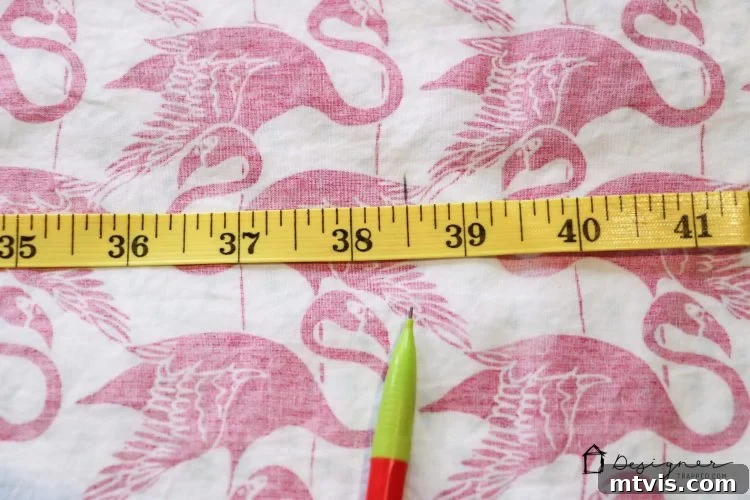 Transform Your Bed with a Flat Sheet Canopy 3 Precisely cutting through two layered flat sheets with a rotary cutter for the bed canopy project.