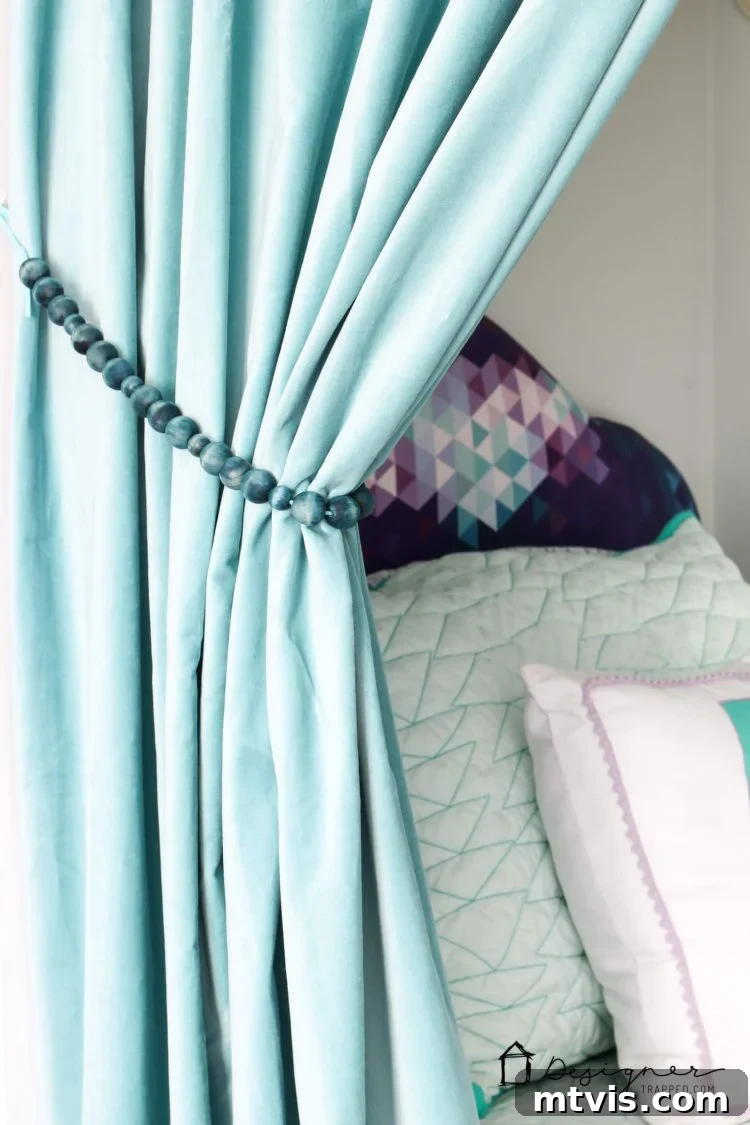 Effortless Handmade Curtain Ties 13 A wide shot showcasing how the DIY wood bead tie backs enhance the overall aesthetic of a window treatment.
