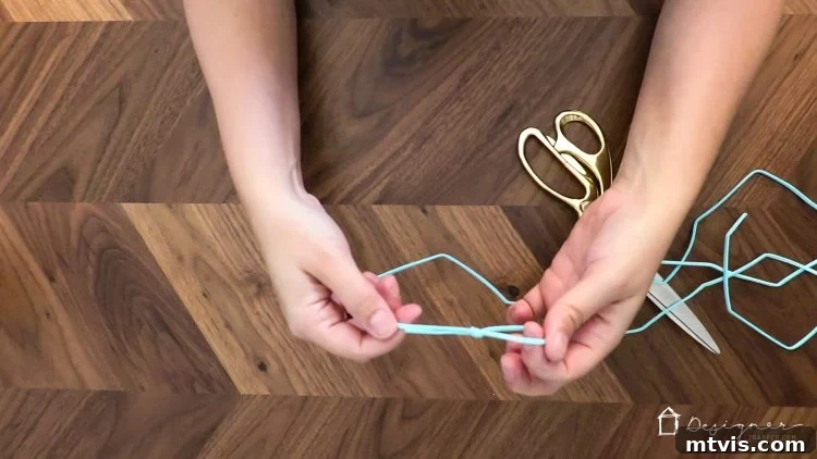 Effortless Handmade Curtain Ties 6 Tying a secure loop knot at one end of a suede cord, preparing it for bead threading.