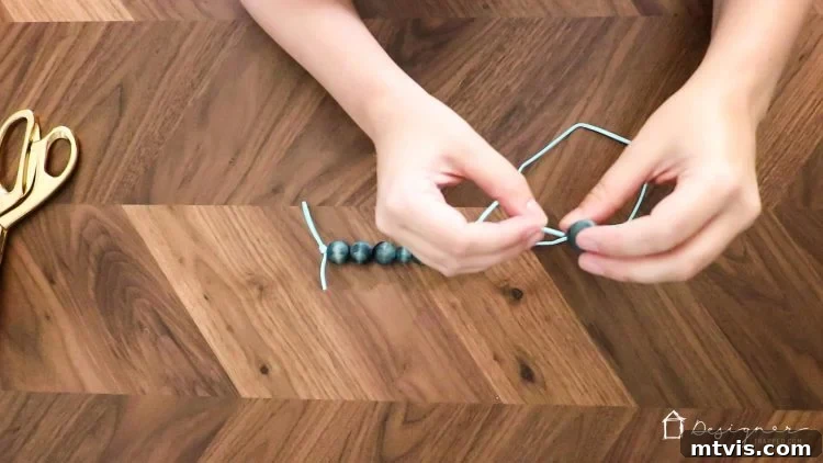 Effortless Handmade Curtain Ties 7 Threading stained wood beads onto a suede cord in a beautiful pattern for custom curtain tie backs.