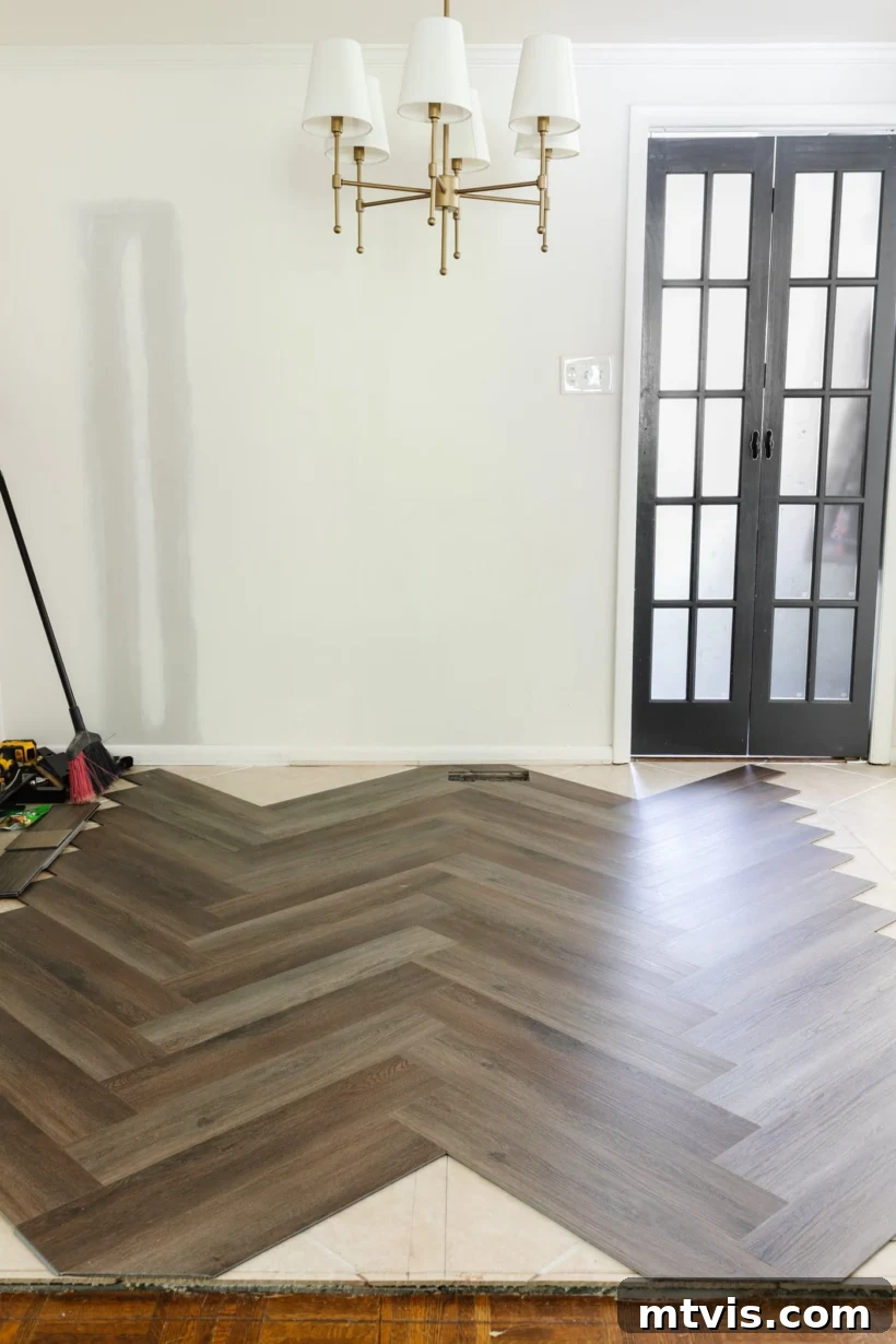20 Affordable Flooring Ideas That Look Expensive 10 cheap luxury vinyl plank flooring installed in a herringbone pattern