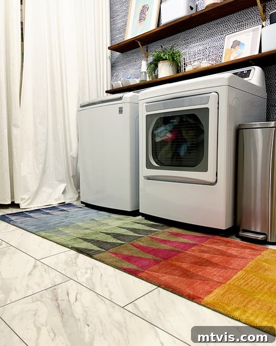20 Affordable Flooring Ideas That Look Expensive 4 luxury vinyl tile that looks like marble in laundry room