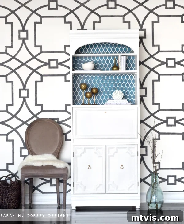 Furniture makeover project featuring a bookcase transformed into a secretary desk with custom stencils made using a cutting machine.
