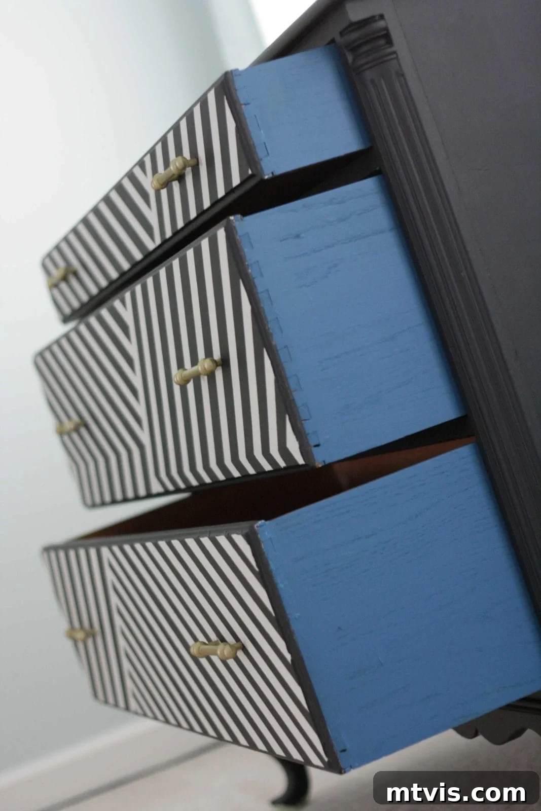 Beyond Basic: 15 Stunning DIY Dresser Redesigns 3 Learn how to paint a dresser to create a bold statement piece with these DIY ideas.
