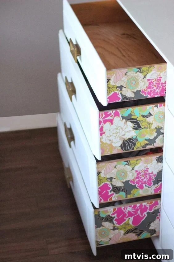 Beyond Basic: 15 Stunning DIY Dresser Redesigns 5 Add a pop of pattern with wallpapered drawer sides in your DIY dresser project.