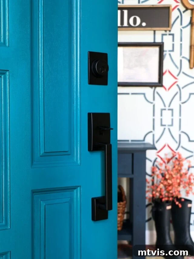 Make Door Holes Vanish: Your DIY Guide 2 A freshly painted front door stands open, inviting light into a welcoming foyer, showcasing the beauty of a well-maintained entrance.