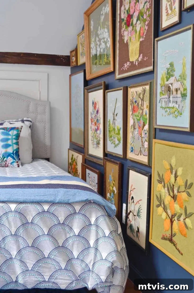 Transform Your Space: 27 Gallery Wall Ideas and Practical Hacks 12 A captivating floor-to-ceiling gallery wall filled with an extensive collection of framed embroidered art pieces, creating a rich tapestry of texture and pattern in a room.