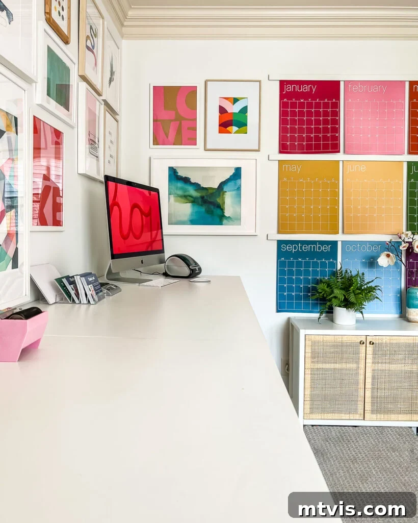 Transform Your Space: 27 Gallery Wall Ideas and Practical Hacks 16 An inspiring and colorful gallery wall prominently displayed in a home office, featuring a diverse collection of art and decor that fills the space with creativity and personal style.