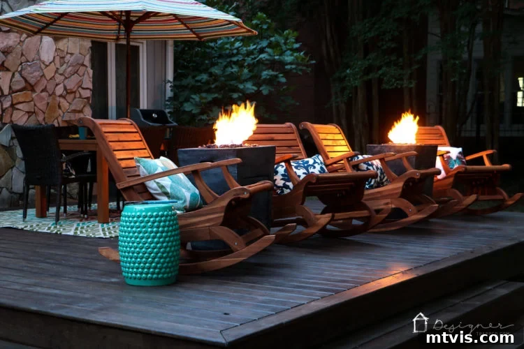 Another perspective of the transformed deck at night, with fire columns casting a warm light over the various seating arrangements and custom DIY features.