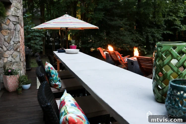 A detailed view of the outdoor dining set and surrounding decor on the beautifully renovated DIY deck, ready for al fresco meals and entertainment.