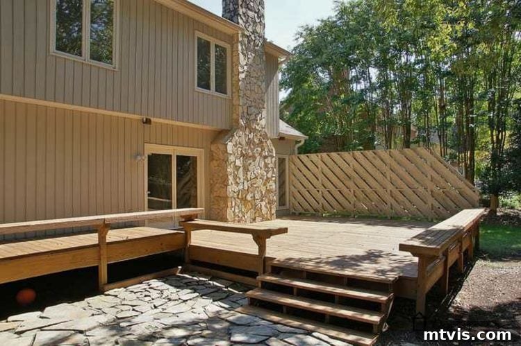 Another view of the old, worn deck, highlighting the splintered surfaces and outdated design elements that prompted the DIY renovation.