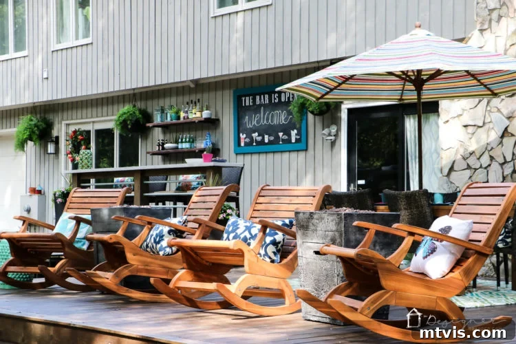 A beautifully renovated DIY deck featuring a modern dining set with a Teak table and all-weather wicker chairs, surrounded by natural wood elements.