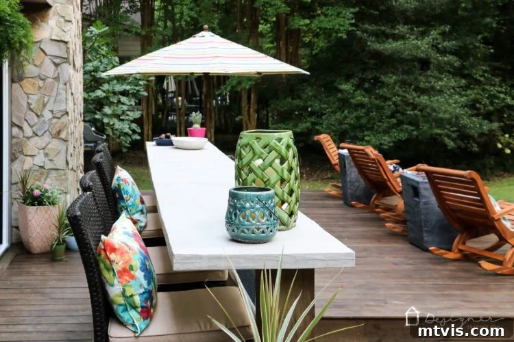 Close-up of the inviting outdoor dining area on the DIY deck, showcasing the Hayneedle furniture and elegant table settings.