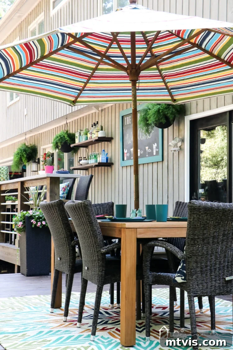 The new DIY deck showcasing a variety of outdoor furniture from Hayneedle, including a dining set and lounge chairs, designed for comfort and style.
