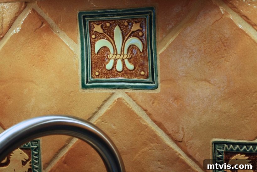 My Backsplash Solution Painting Tile 4 Close-up of the tile backsplash before painting, showing texture and decorative elements
