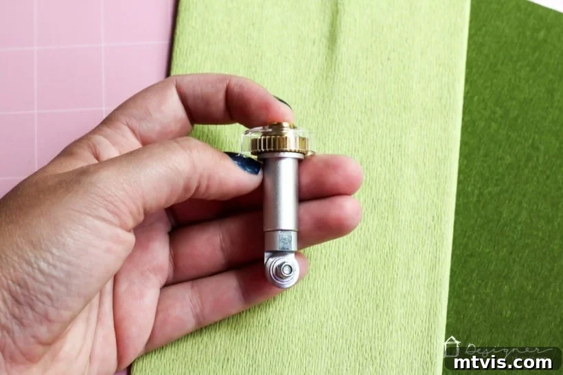 The Cricut Edge Perfecting Crepe Paper Succulents 4 The Cricut Maker cutting machine with its versatile tools, including the Rotary Blade, ready for precision crafting.