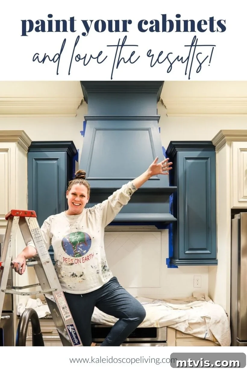 Unlock Your Kitchen's Potential The Ultimate Cabinet Paint Guide 2 Tasha, of Kaleidoscope Living, stands on a ladder, demonstrating the best paint for kitchens.