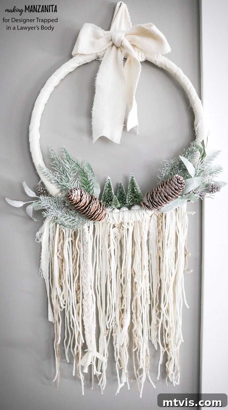 Craft Your Boho Winter Wreath 11 The finished DIY Boho Winter Wreath, displaying its cozy textures, neutral colors, and unique bohemian style, ready to enhance your home's winter decor with handcrafted elegance.