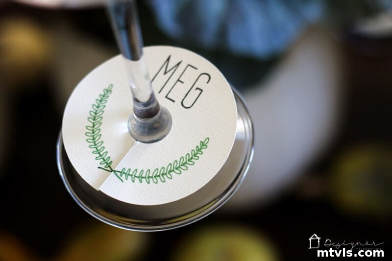 Multiple wine glasses adorned with unique DIY charms, demonstrating how they differentiate drinks at a gathering.