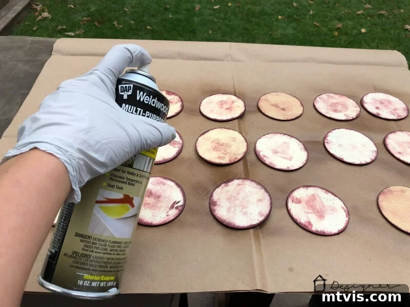 Transform Your Cherished Photos Into Handmade Christmas Ornaments 5 Applying DAP Weldwood Multipurpose Spray Adhesive to wood discs