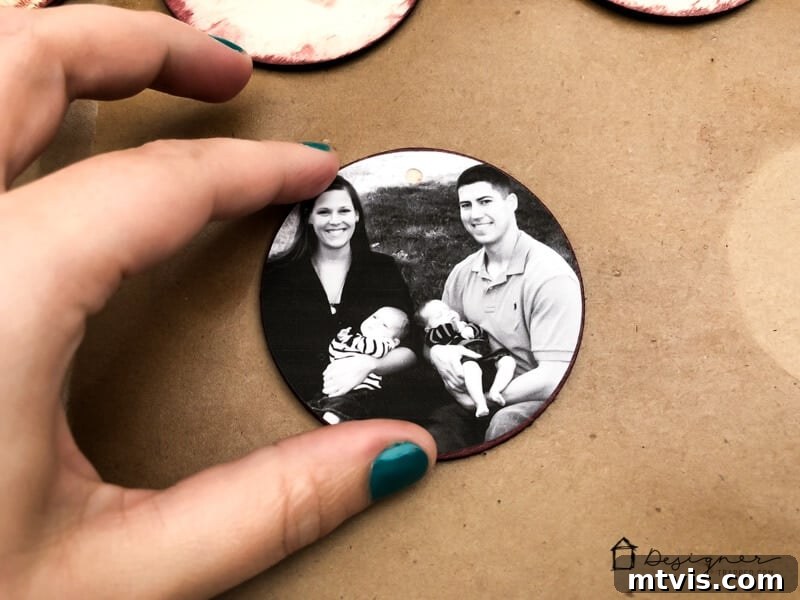 Transform Your Cherished Photos Into Handmade Christmas Ornaments 6 Placing circular photos onto wood discs for DIY Christmas ornaments