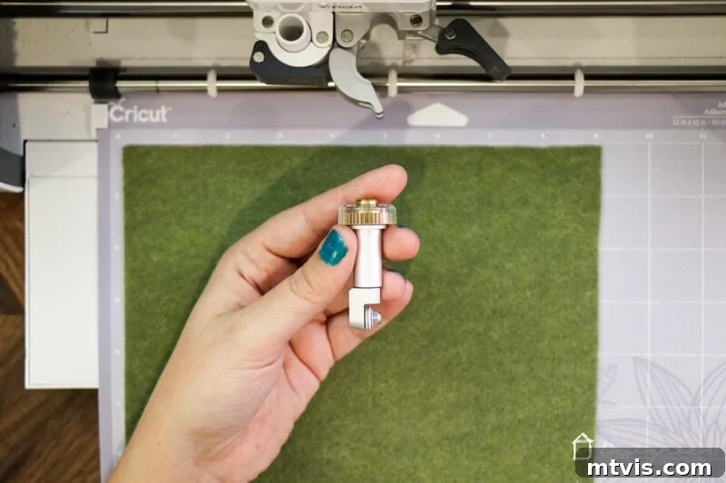 Craft Charming Felt Ornaments for Christmas 3 Cricut Maker precisely cutting felt for DIY Christmas ornaments, showcasing the machine's efficiency.