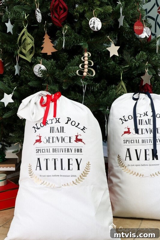 Handcrafted Santa Sacks for Magical Christmas Mornings 8 Close-up of personalized DIY Santa sacks with children's names, showcasing the vibrant colors and festive design against a bokeh Christmas tree background