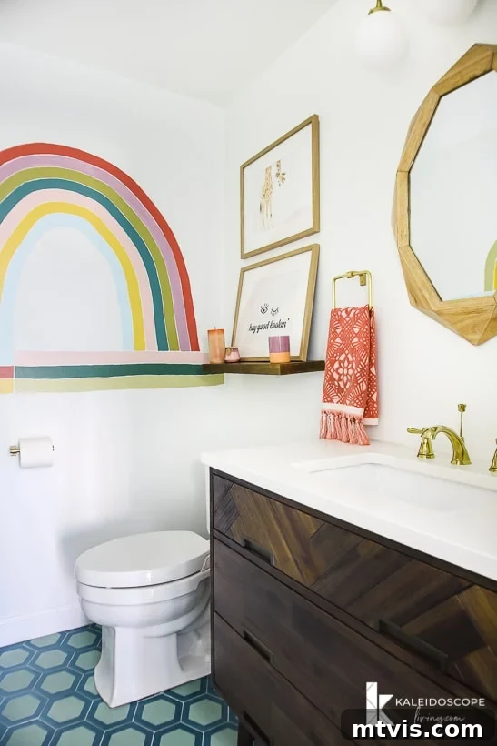 Space-Saving Secrets: 9 Genius Hacks for Bigger-Looking Rooms 12 A bathroom with a large painted rainbow and blue honeycomb-patterned floor. The light walls in this small bathroom visually expand the space, creating a cheerful and open atmosphere.
