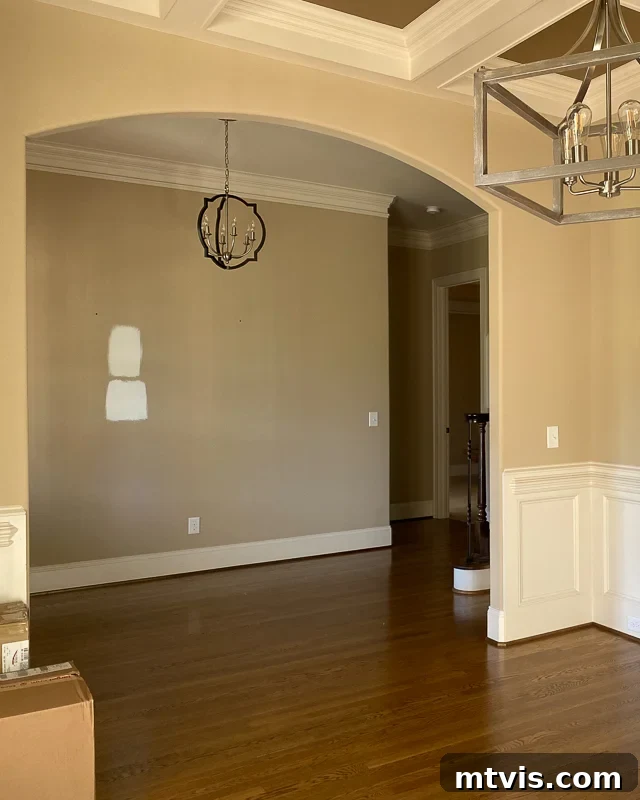Space-Saving Secrets: 9 Genius Hacks for Bigger-Looking Rooms 10 An empty hardwood floor room has a wide arch into an empty hallway. This 'before' picture highlights the potential for brightness and openness with a lighter color palette.