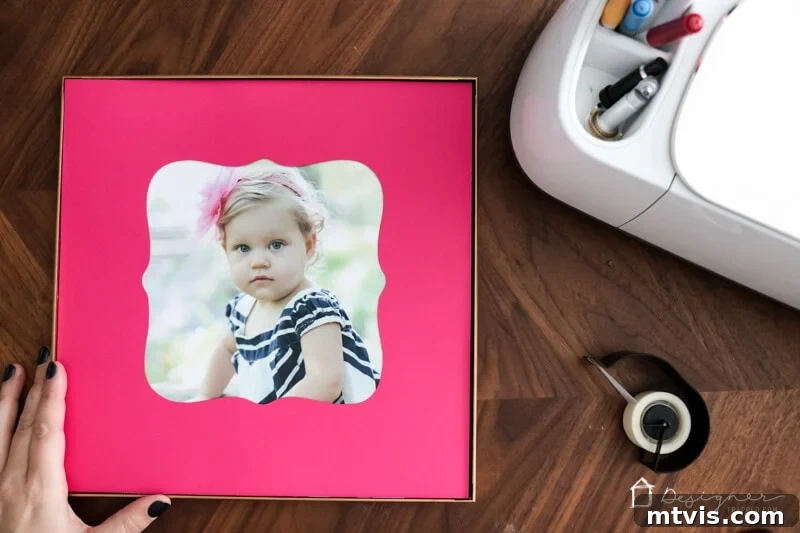 Craft Custom Photo Mats for Pennies 7 Inserting a matted photo into a white 12x12 square frame, showcasing the DIY picture mat.