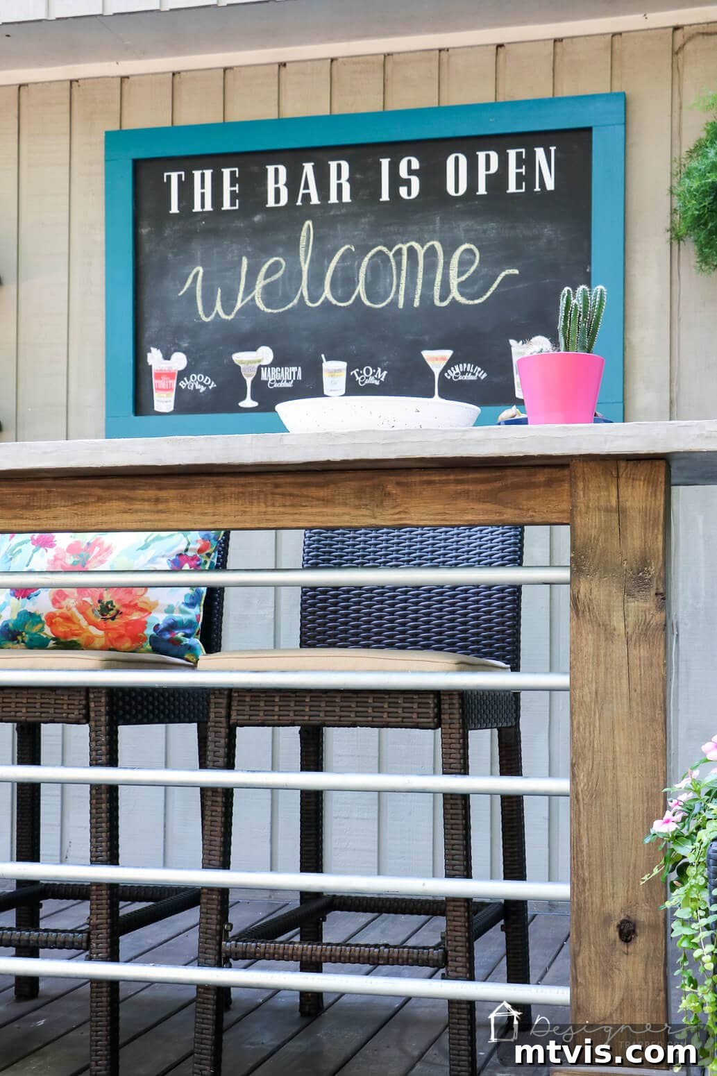 A creative shot of the outdoor chalkboard adding charm to the deck decor.
