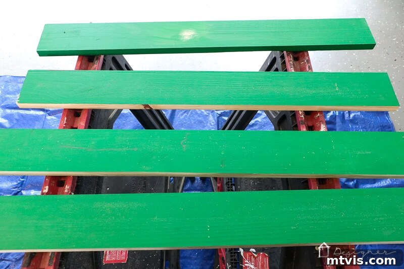 Cutting the wooden frame pieces for a DIY outdoor chalkboard project.