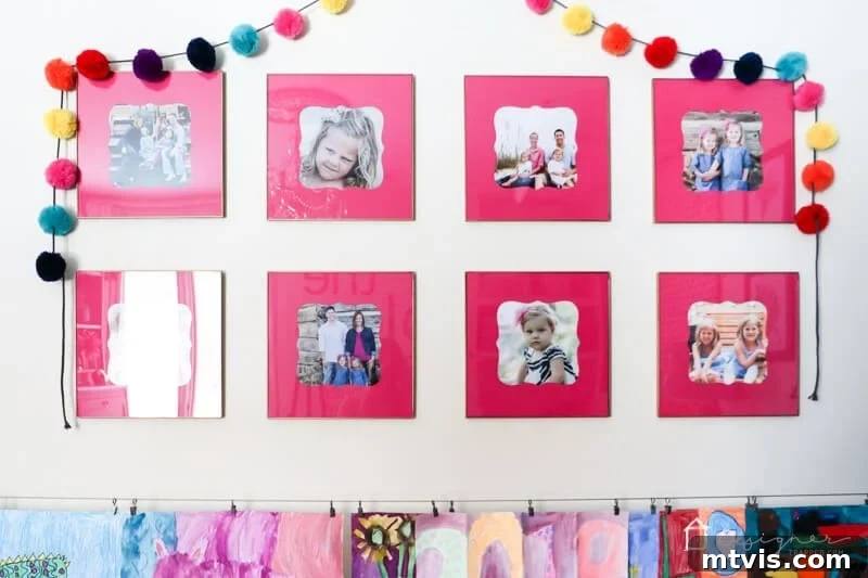 Beautifully arranged gold frames with pink photo mats, displayed in Attley's room.
