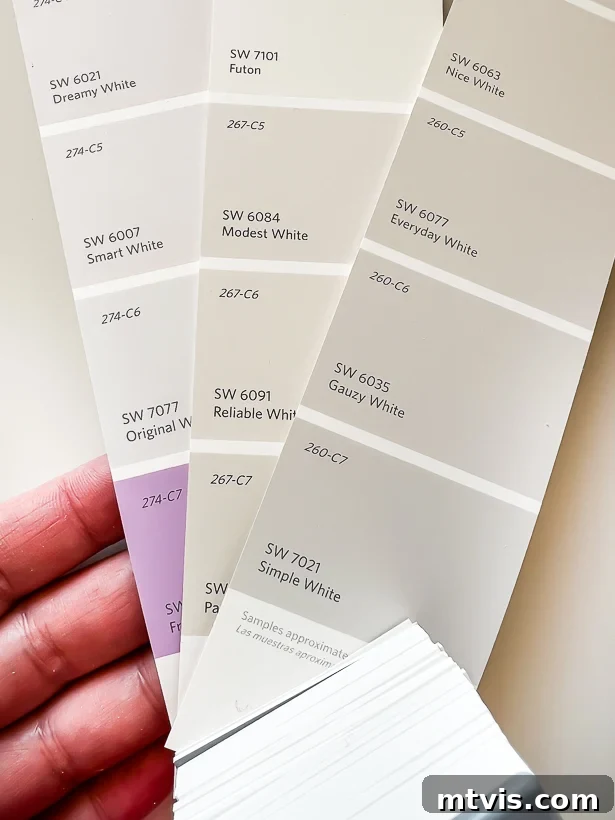 Unlock Your Home's Perfect Palette: Easy Paint Color Selection 7 Image illustrating distinct purple undertones in white paint chips when observing the darkest shade.