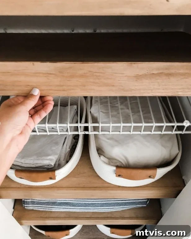 Smart Solutions for a Perfectly Organized Linen Closet 11 photo of DIY wood shelves covering wire shelving in linen closet