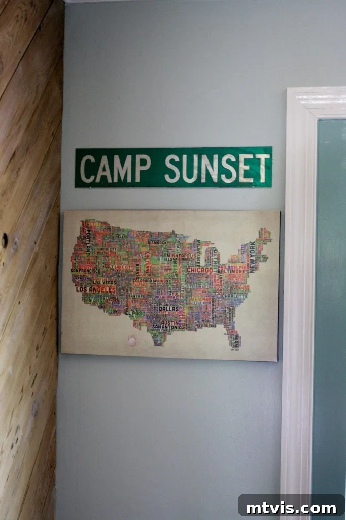 Custom typography map and sentimental street sign adding personal flair to the kitchen decor.