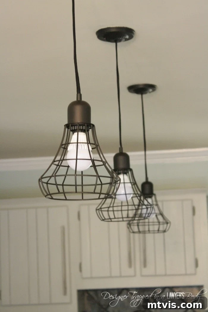 Shop the look: Industrial pendant lighting for a modern kitchen on a budget.