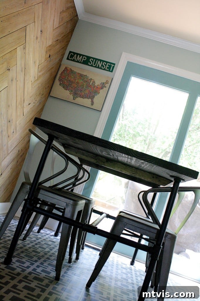 Decorative 'eat & drink' letters on the herringbone plank wall, adding a personal touch.