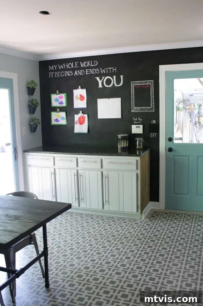 Chalkboard wall with family artwork and calendar, next to relocated base cabinets for practical storage.