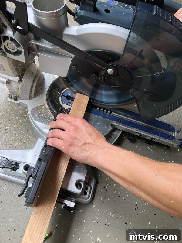 Sparkle and Store: DIY Jewelry Organizers for Every Piece 4 Compound miter saw making precise cuts on a 2x2 wood piece