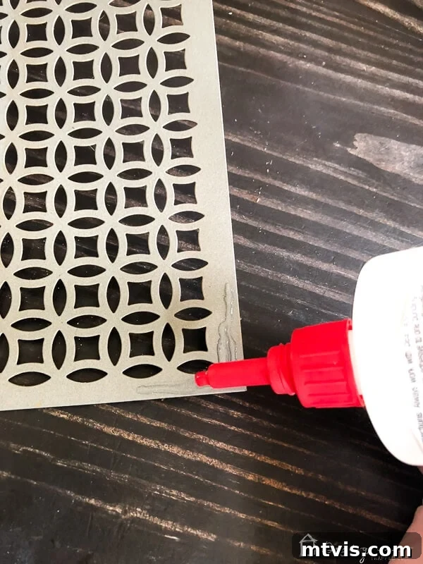 Sparkle and Store: DIY Jewelry Organizers for Every Piece 6 Applying DAP Rapid Fuse to the corner of an aluminum sheet